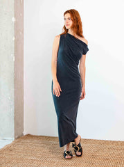 Woman wearing the cupro drape midi dress in slate black showing modern 7/8 length silhouette by Cossac