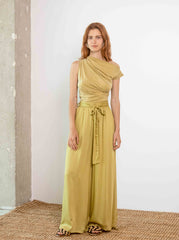 Woman wearing the cupro drape neckline top in soft olive styled in a clean minimal outfit by Cossac