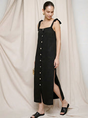 Model wearing the black Lourdes Dress with a straight maxi silhouette by Noumenon