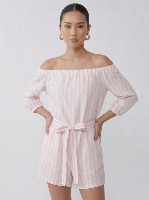 Model wearing the soft pink off shoulder linen playsuit with relaxed summer fit