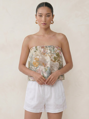 Model wearing the Botanic Garden ruffle tube top with a floaty strapless silhouette by Noumenon