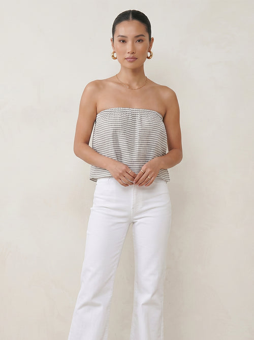 Model wearing the Marine Stripes ruffle tube top with a floaty strapless silhouette