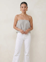 Model wearing the Marine Stripes ruffle tube top with a floaty strapless silhouette