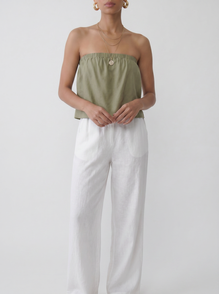Model wearing the sage ruffle tube top with a floaty strapless summer silhouette by Noumenon