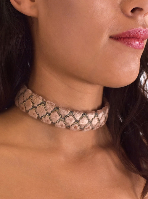 Close-up of vintage pink choker showing limited deadstock furniture fabric texture