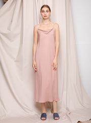Model wearing the strawberry sorbet Hailey Slip Dress with a fluid cowl neck silhouette by Noumenon