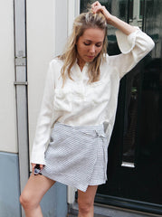 Woman wearing the linen skort styled as a relaxed summer outfit with sandals