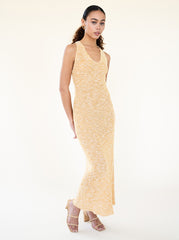 Woman wearing the Naomi Dress styled in a minimal indoor setting showing its fluid silhouette by Sisterhood