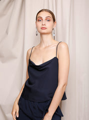 Model wearing the midnight blue Romee Slip Top with a soft cowl neck silhouette by Noumenon